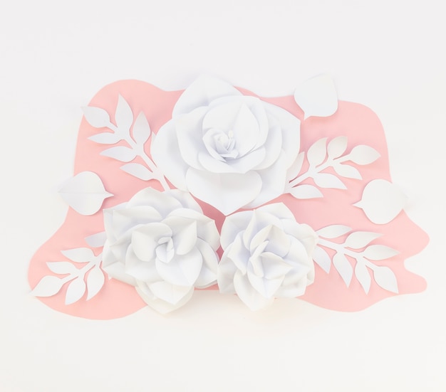 Frame with spring paper flowers on white background