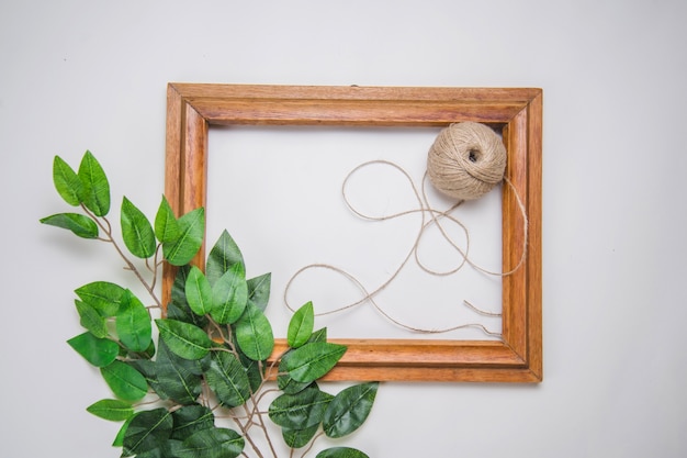 Free photo frame with wool and leaves