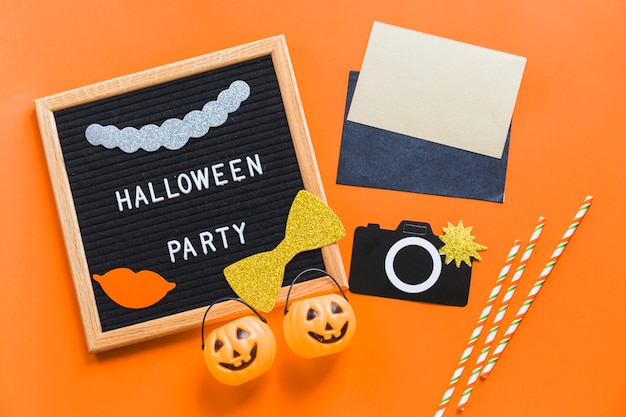 Free photo frame with writing near halloween supplies