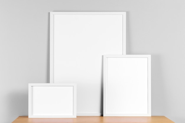 Free photo frames mock up on table