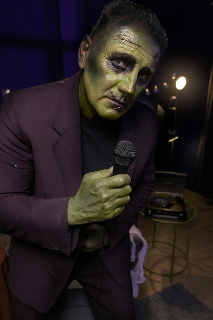 Free photo frankenstein holding microphone medium shot