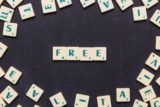 Free Photo free scrabble letters over black background