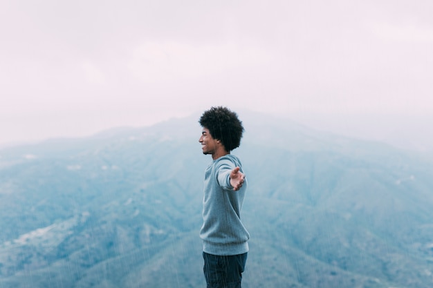 Freedom concept with hiker on mountain