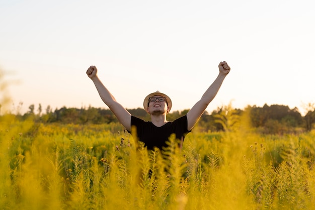 Freedom concept with a young man in the nature