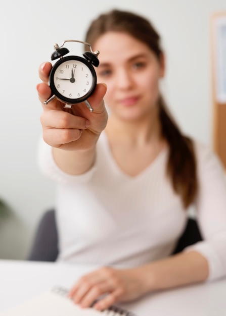 Free photo freelance woman with clock