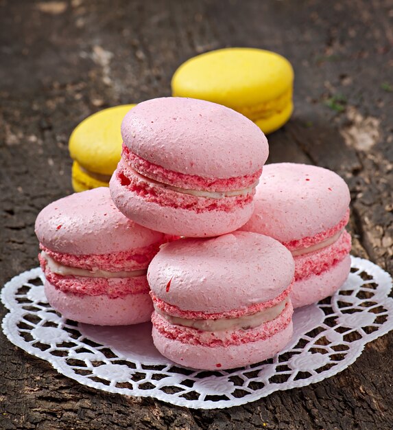 French colorful macaroons on a wooden background