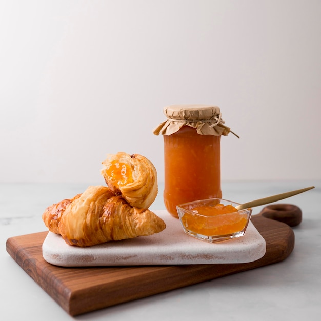 French croissant breakfast and jam