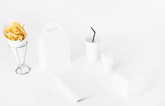 French fries; parcel and disposal cup on white backdrop