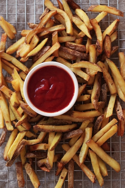 French fries with ketchup sauce, top view