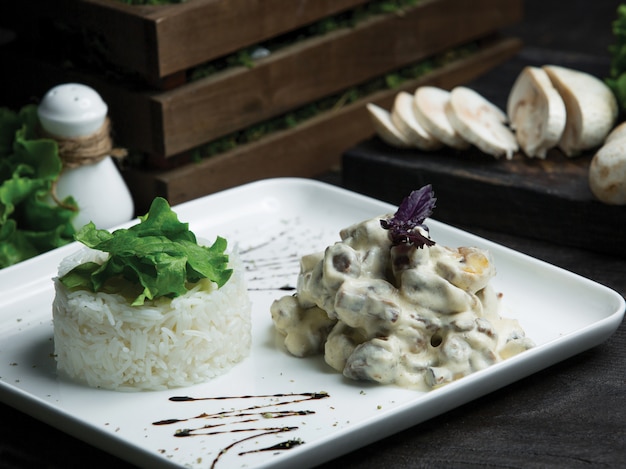 French kitchen mushroom sauteed in cream sauce with rice