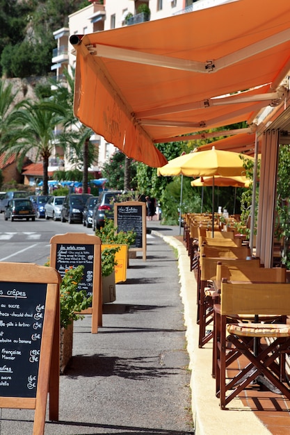 French restaurant scene with menu board