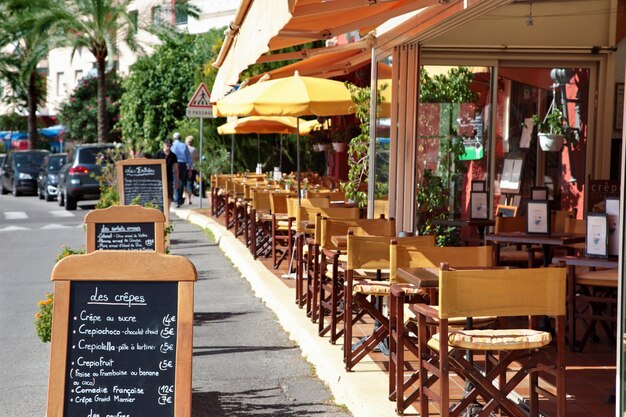 French restaurant scene with menu board