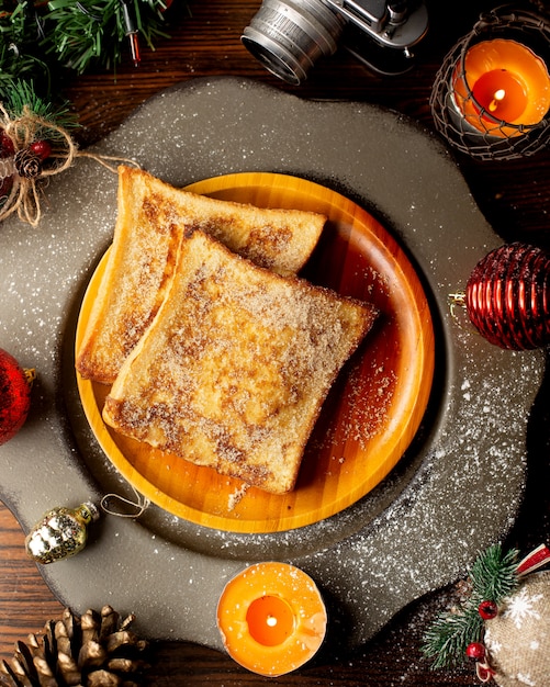 French toasts on a wooden plate