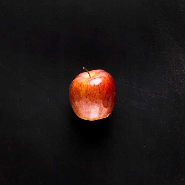 Fresh apple on black desk