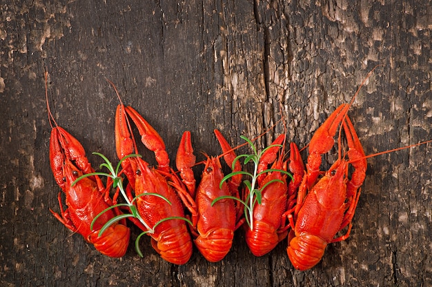 Fresh boiled crawfish on the old wooden surface