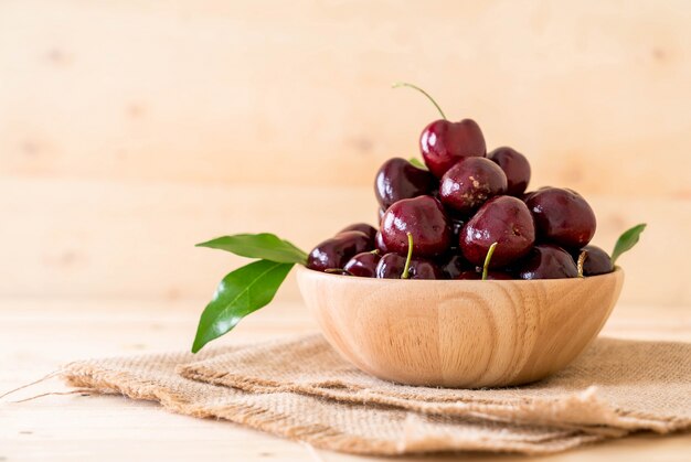 fresh cherry in wood bowl