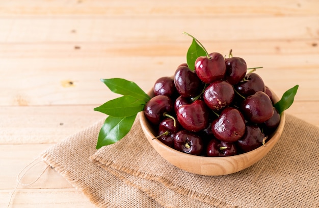 fresh cherry in wood bowl