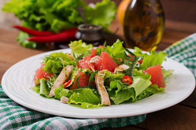 Fresh chicken salad, grapefruit, lettuce and honey mustard dressing. Dietary menu. Proper nutrition.