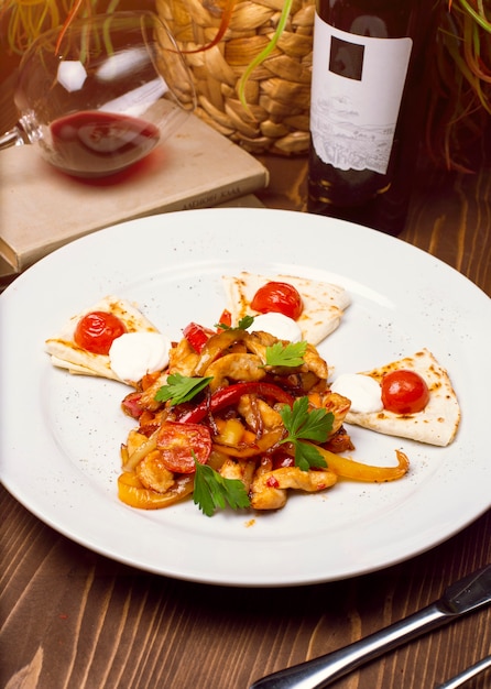 Fresh chicken salad with vegetable dressing, arabic caucasian bread on a white plate. Dietary menu. Proper nutrition.