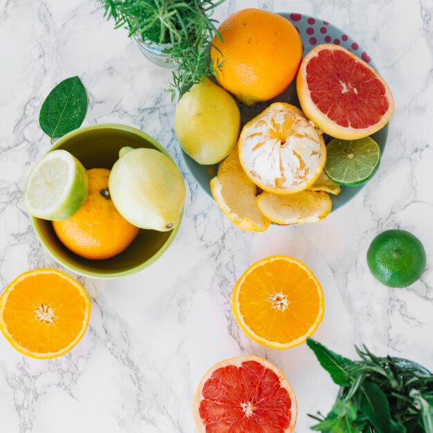 Fresh citrus fruits on marble