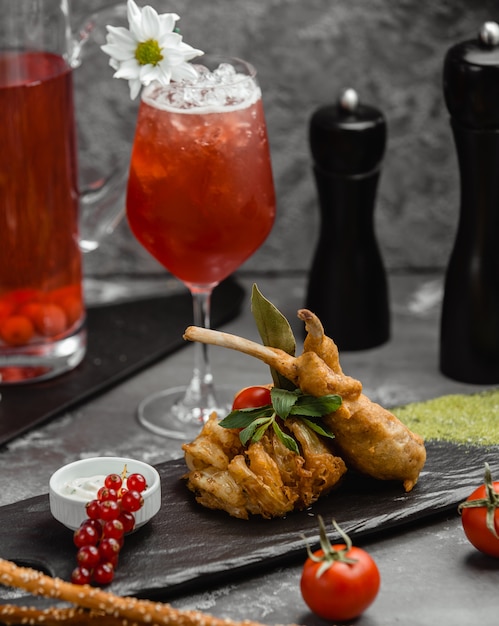 Fresh cocktail with berries and stuffed meat