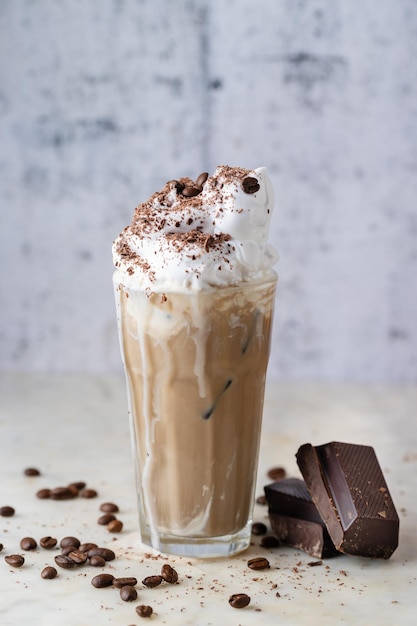 Fresh cold coffee with milk and whipped cream