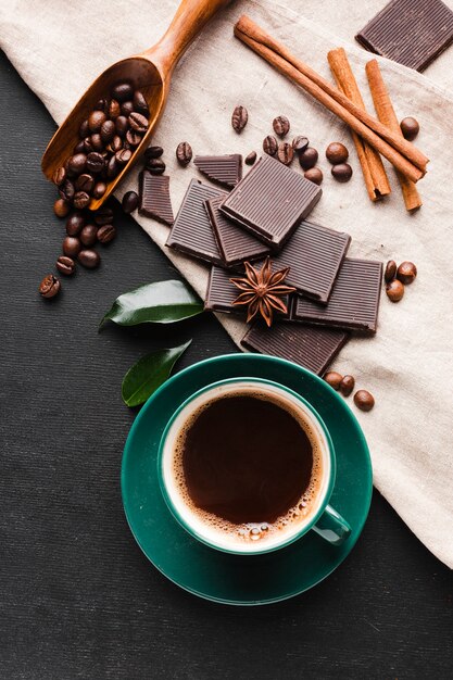 Fresh cup of coffee with chocolate on the table