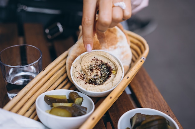 Fresh delicious hummus, pita bread and pickles cucumbers