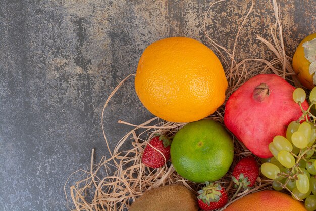 Fresh different fruits on marble space. 