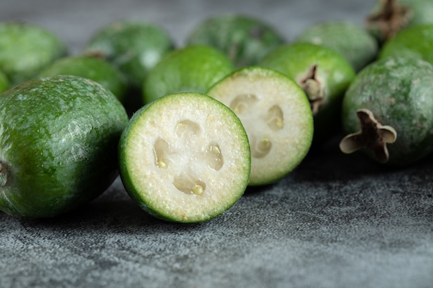 Free photo fresh feijoa fruits on marble surface.