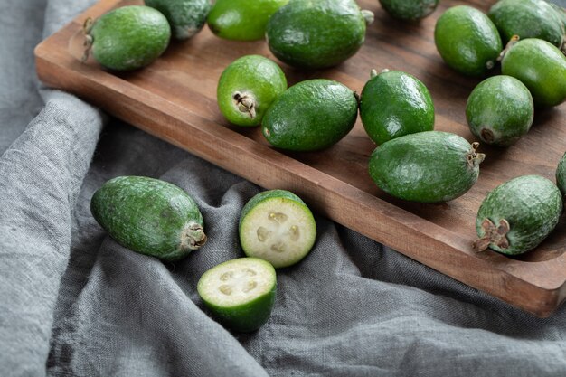 Fresh feijoa fruits on wooden board