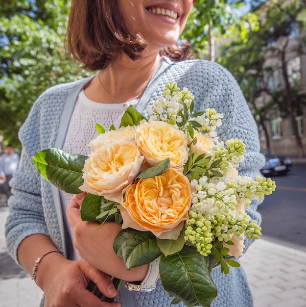 fresh flowers bouquet in girl hands