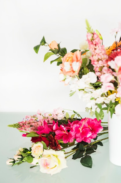 Free Photo fresh flowers on glass desk in floral shop