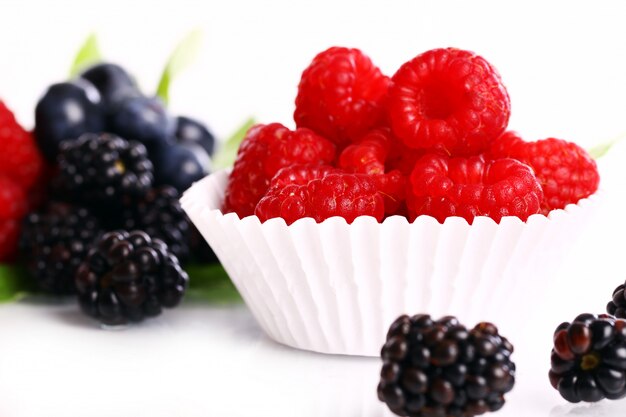 Fresh forest berries over white