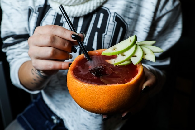 Fresh fruit juice served in orange peel