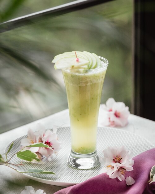 Fresh fruit smoothie with apple slices