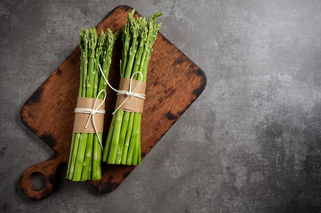 Fresh green asparagus on table.