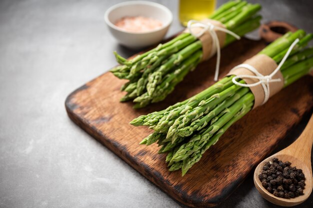 Fresh green asparagus on table.