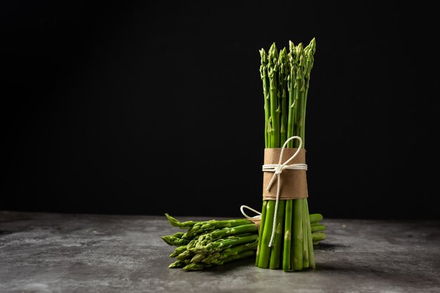 Fresh green asparagus on table.