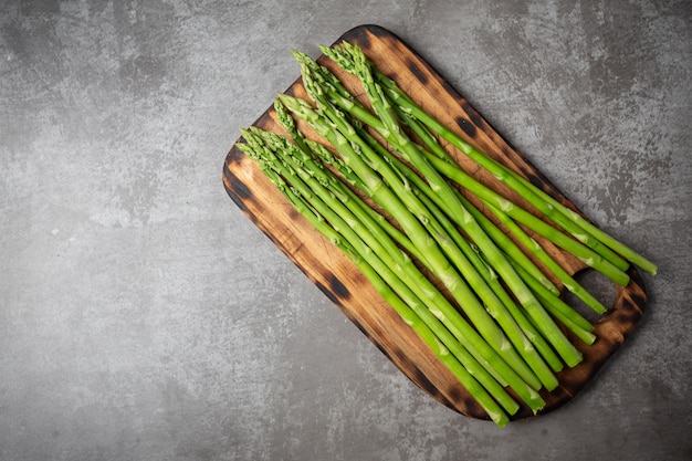 Fresh green asparagus on table.