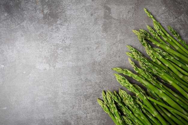 Fresh green asparagus on table.