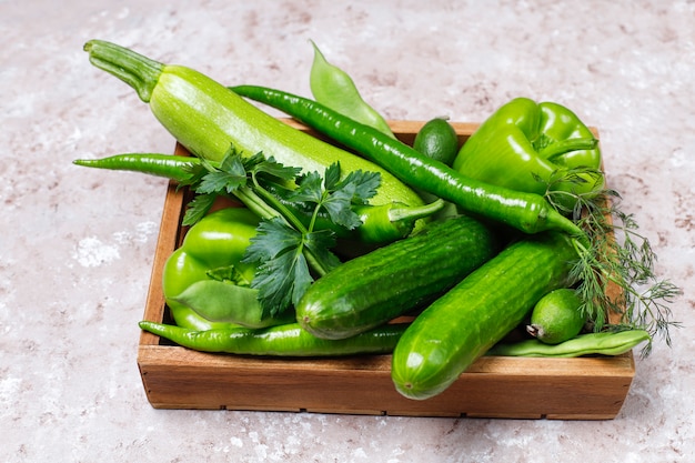 Free photo fresh green vegetables on concrete surface