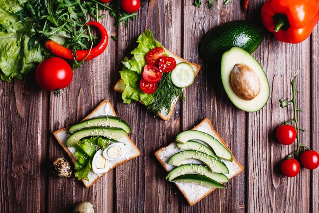 Fresh and healthy food. Breakfast or lunch ideas. Bread with cheese, avocado and greenery