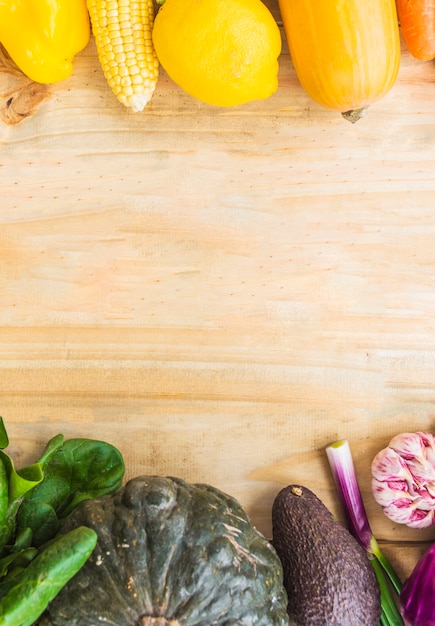 Fresh healthy vegetables on wooden background