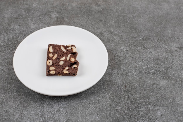 Fresh homemade cake slice on plate. Chocolate cake with peanut,.