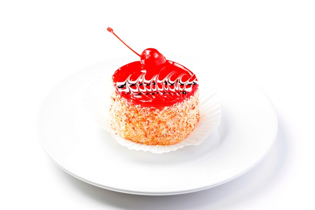 Fresh homemade jelly cake garnished with cherry