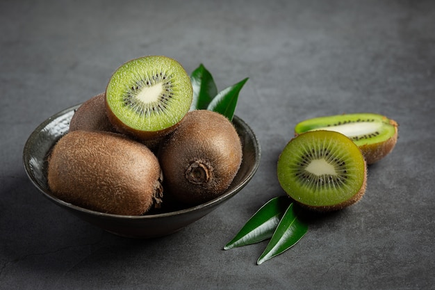 Fresh kiwi, cut into half, put on silver plate