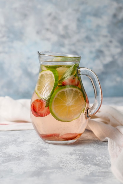 Free photo fresh lime, strawberry and mint infused water, cocktail, detox drink, lemonade. summer drinks. health care concept.