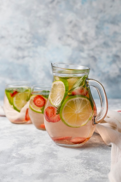 Fresh lime, strawberry and mint infused water, cocktail, detox drink, lemonade. Summer drinks. Health care concept.