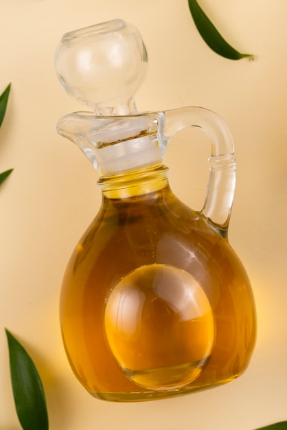 Free photo fresh olive oil bottle on table